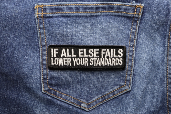 If All Else Fails Lower Your Standards Funny Iron on Patch shown on jeans