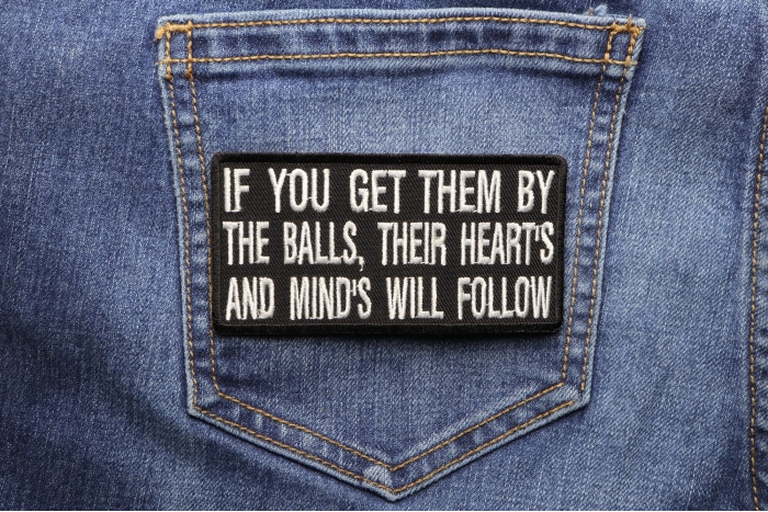 If You Get Them By The Balls Their Hearts and Minds Will Follow Patch shown on jeans