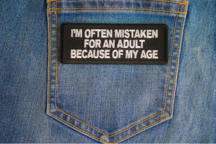 Im Often Mistaken For An Adult Because Of My Age Patch shown on jeans