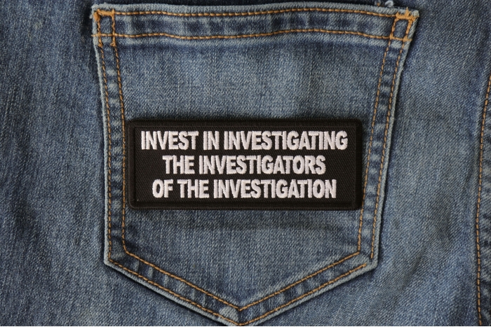 Invest in Investigating the Investigators of the Investigation Funny Iron on Patch shown on jeans