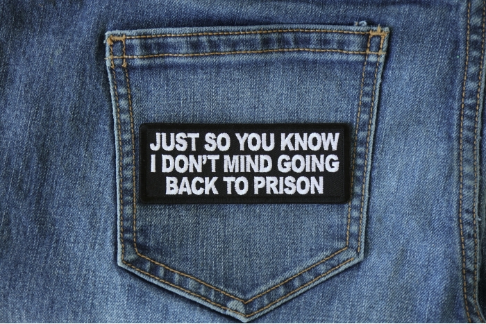 Just So You Know I don't Mind Going Back to Prison Funny Iron on Patch shown on jeans