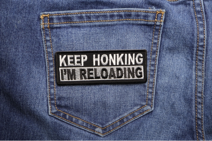 Keep Honking I'm Reloading Patch shown on jeans