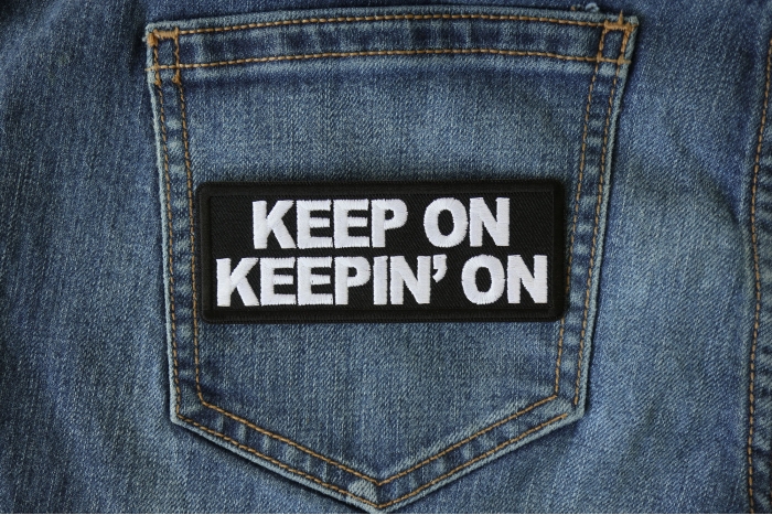 Keep on Keeping On Patch shown on jeans