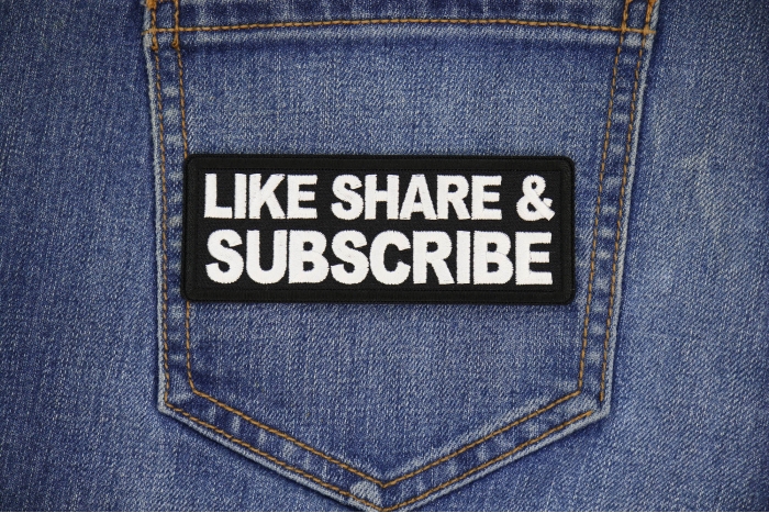 Like Share Subscribe Patch shown on jeans