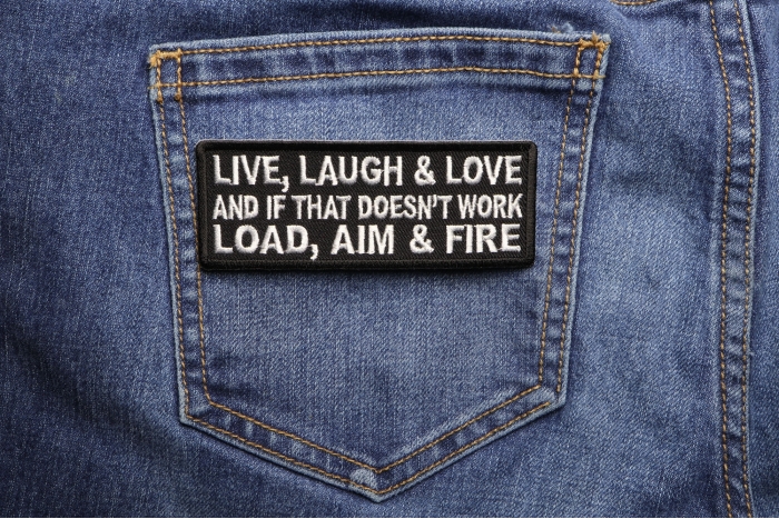 Live Laugh Love and If That Doesn't Work Load Aim and Fire Funny Iron on Patch shown on jeans
