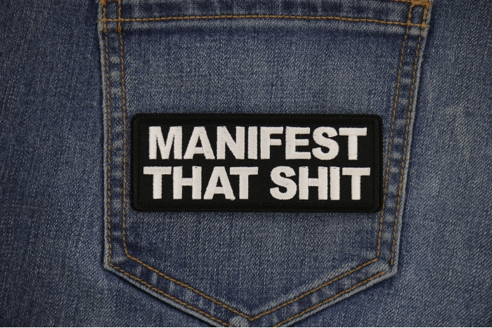 Manifest That Shit Patch shown on jeans