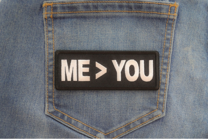 Me greater than you patch shown on jeans