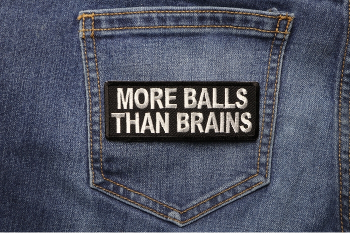 More Balls Than Brains Funny Iron on Patch shown on jeans
