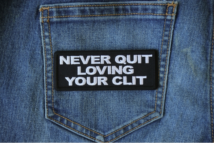 Never Quit Loving Your Clit Funny Iron on Patch shown on jeans