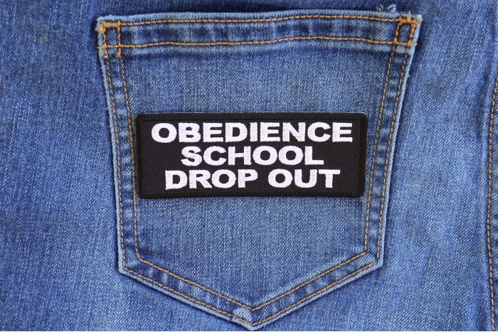 Obedience School Drop Out Patch shown on jeans