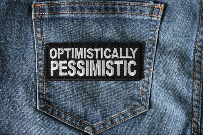 Optimistically Pessimistic Funny Iron on Patch shown on jeans