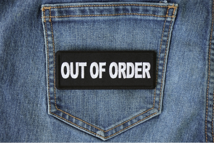 Out Of Order Patch shown on jeans