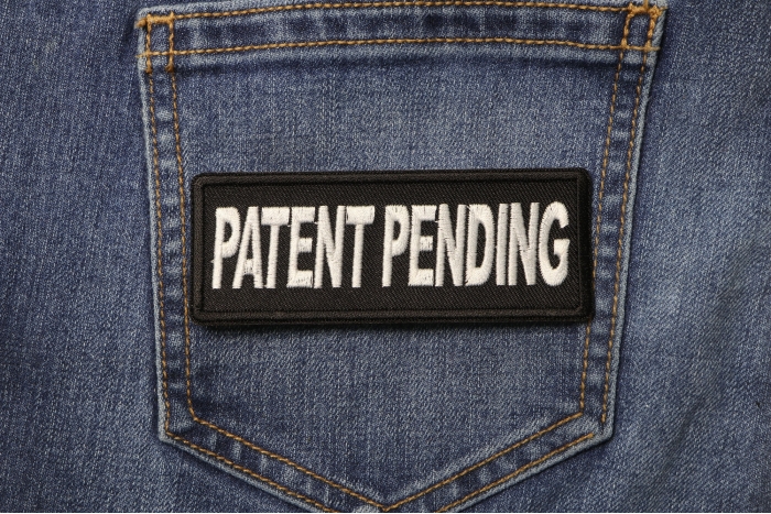 Patent Pending Funny Iron on Patch shown on jeans