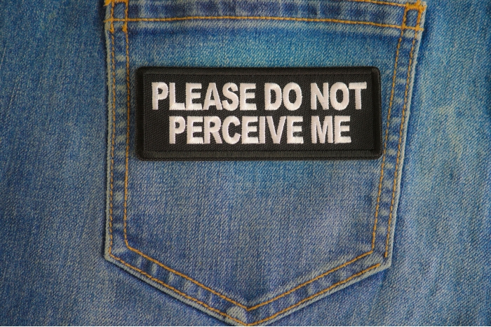 Please Do Not Perceive Me Patch shown on jeans