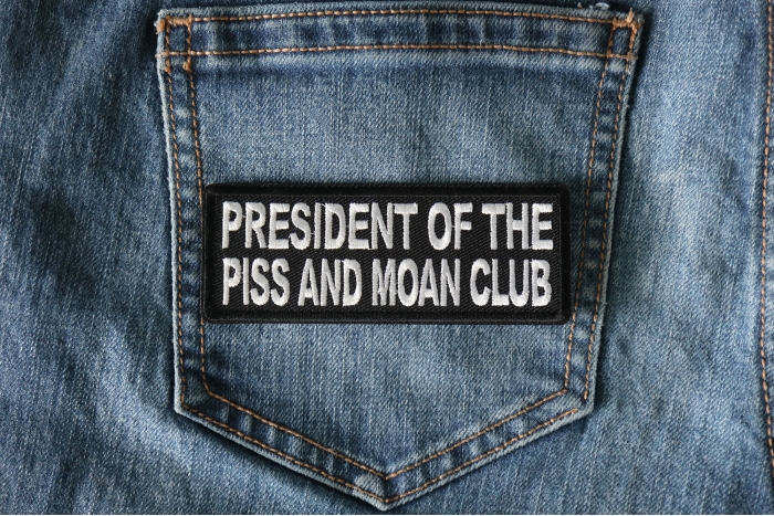 President of The Piss and Moan Club Patch shown on jeans