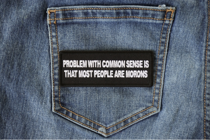 Problem with Common Sense is that most people are Morons Funny Iron on Patch shown on jeans