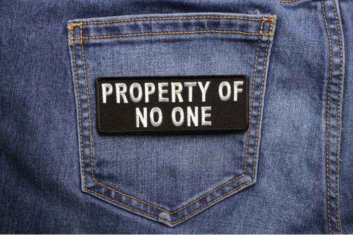 Property Of No One Funny Iron on Patch shown on jeans