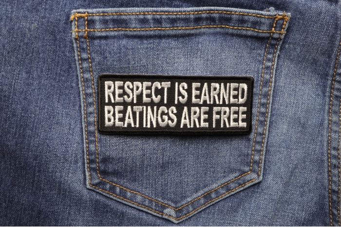 Respect Is Earned Beatings Are Free Funny Patch shown on jeans