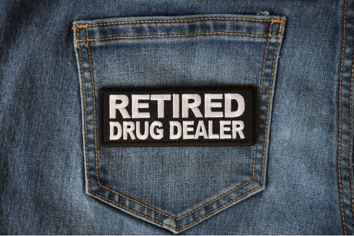 Retired Drug Dealer Funny Iron on Patch shown on jeans