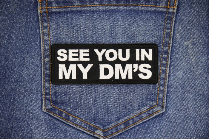 See you in my DMs Patch shown on jeans