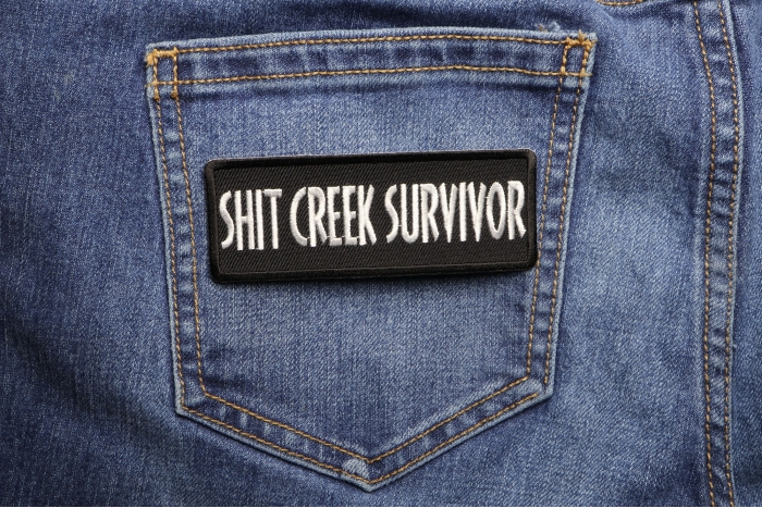 Shit Creek Survivor Patch shown on jeans