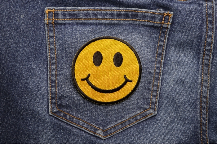 Smiley Face Funny Iron on Patch shown on jeans