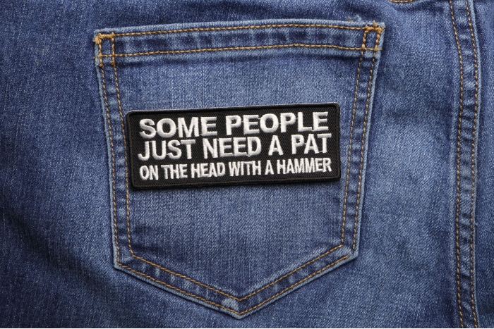 Some People Need A Pat On The Head With A Hammer Patch shown on jeans