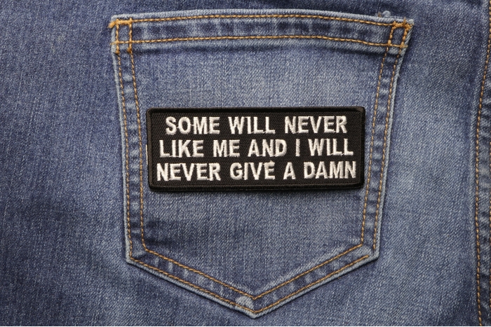 Some Will Never Like Me and I Will Never Give A Damn Funny Iron on Patch shown on jeans