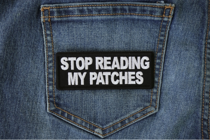 Stop Reading My Patches Patch shown on jeans