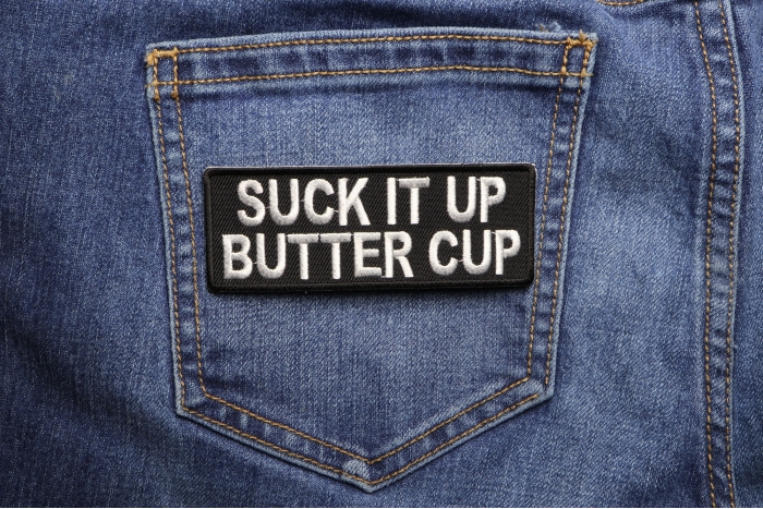 Suck It Up Butter Cup Patch shown on jeans