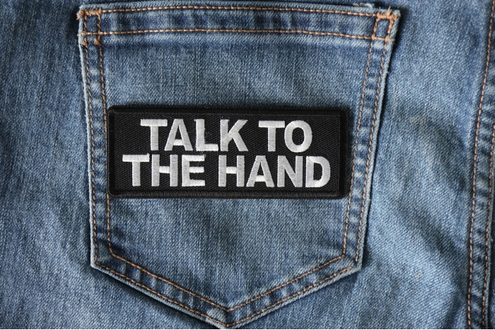 Talk to the Hand Patch shown on jeans