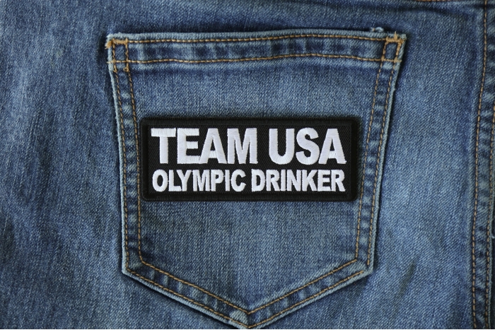 Team USA Olympic Drinker Funny Iron on Patch shown on jeans