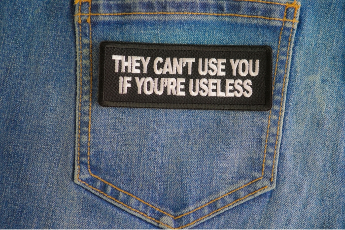 They Cant Use You If You're Useless Patch shown on jeans