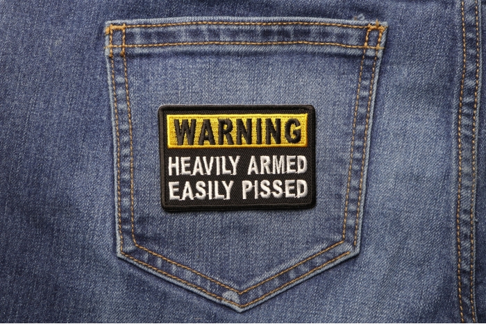 Warning Heavily Armed Easily Pissed Funny Iron on Patch shown on jeans