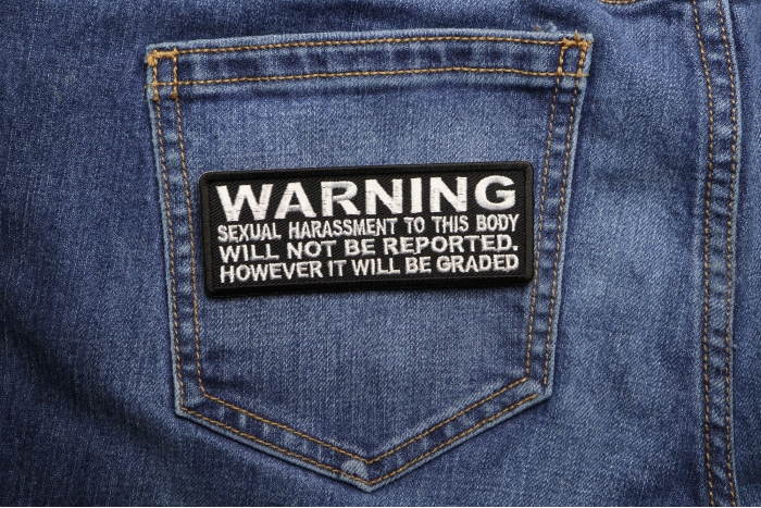 Warning Sexual Harassment to This Body Will Not be Reported It will be Graded Patch shown on jeans