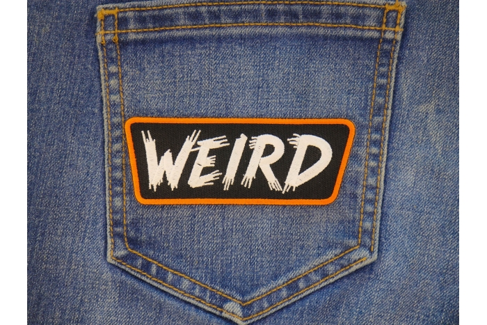 WEIRD Patch shown on jeans