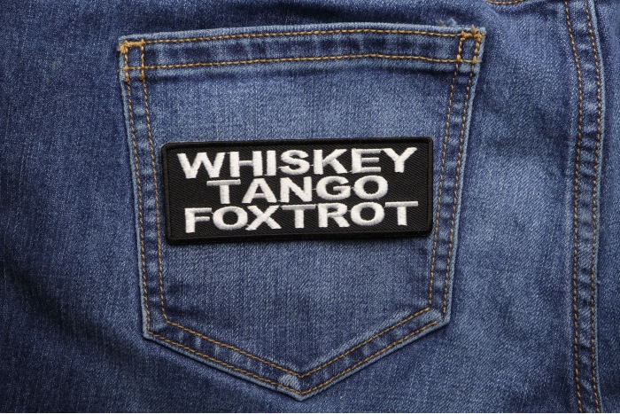 Whiskey Tango Foxtrot Funny Iron on Patch shown on jeans