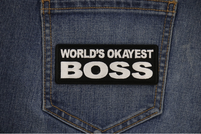 World's Okayest Boss Patch shown on jeans