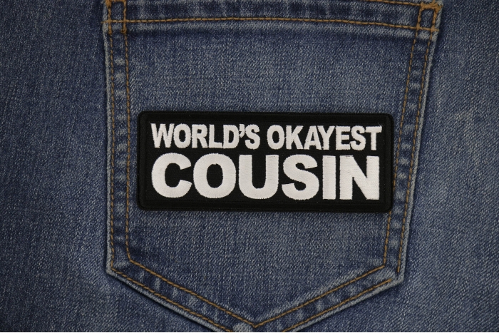 World's Okayest Cousin Patch shown on jeans