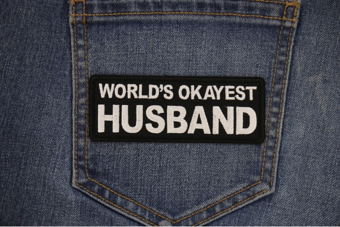 World's Okayest Husband Patch shown on jeans