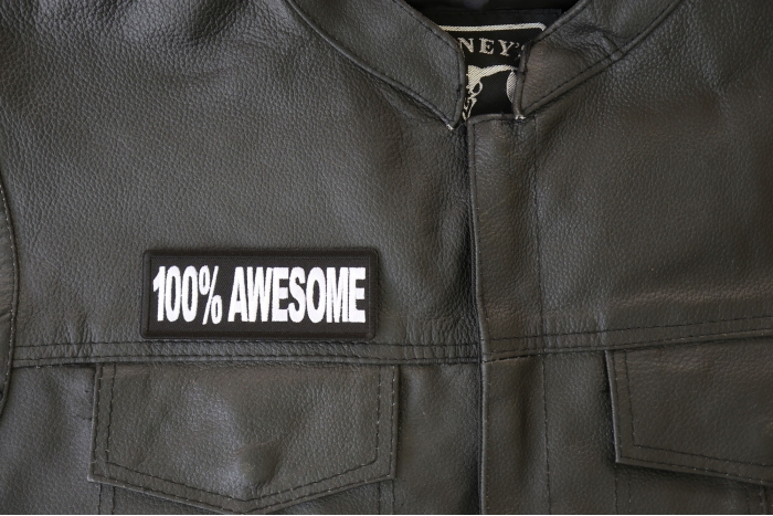 100% Awesome Patch - 4x1.5 inch - Embroidered Iron on Patch shown on leather vest
