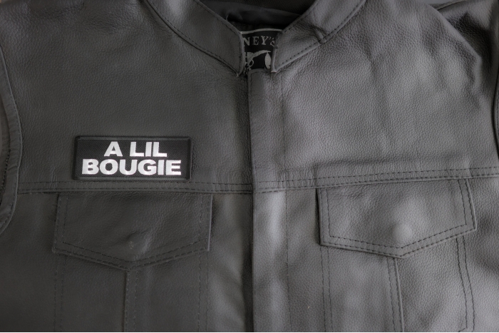A Lil Bougie Patch shown on leather vest