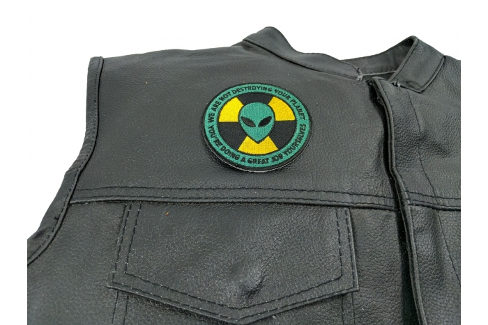 Alien Warning Patch We Are Not Destroying Your Planet You're Doing A Great Job - Iron on Patch - 3x3 inch shown on leather vest