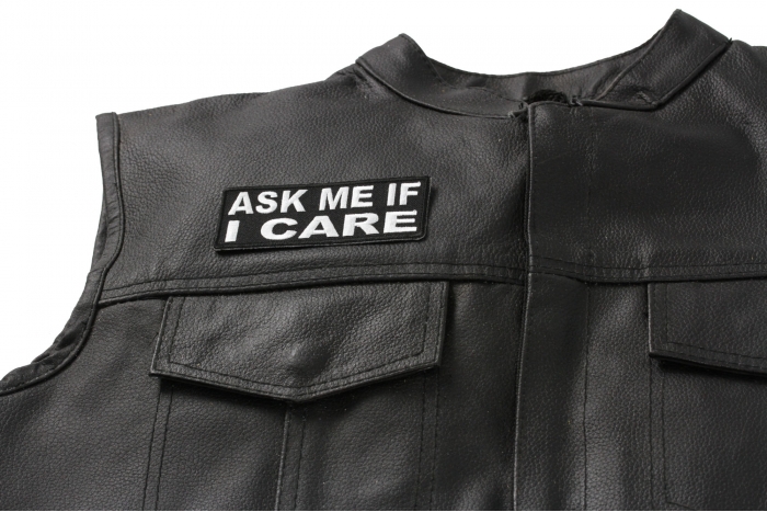 Ask Me If I Care Patch - 4x1.5 inch. Embroidered Iron on Patch shown on leather vest