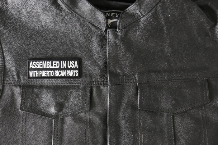 Assembled in USA with Puerto Rican Parts Patch - 4x1.5 inch - Embroidered Iron on Patch shown on leather vest