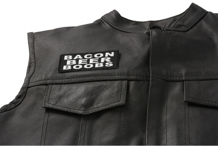 Bacon Beer Boobs Patch - 4x1.5 inch. Embroidered Iron on Patch shown on leather vest