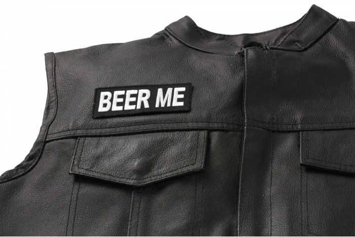 Beer Me Patch - 4x1.5 inch. Embroidered Iron on Patch shown on leather vest