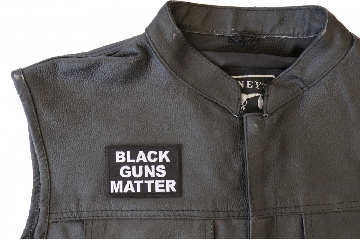 Black Guns Matter Patch - 3x2 inch. Embroidered Iron on Patch shown on leather vest