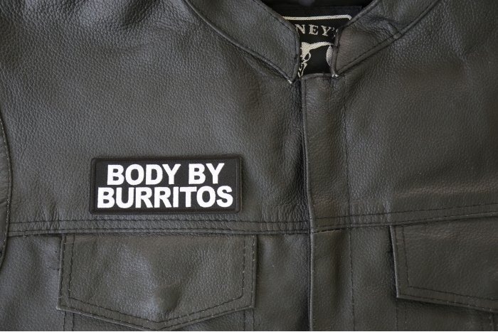 Body by Burritos Patch - 4x1.5 inch - Embroidered Iron on Patch shown on leather vest