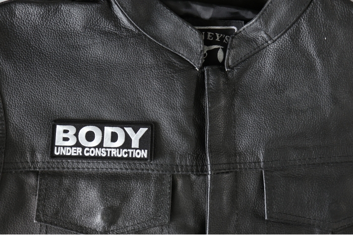 Body under construction Patch, Funny Saying Patches shown on leather vest